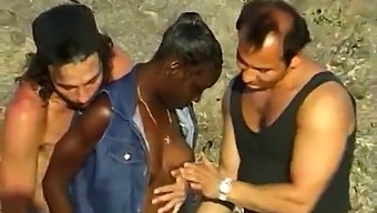African Woman Indulges In Threesome With Two White Men At The Beach